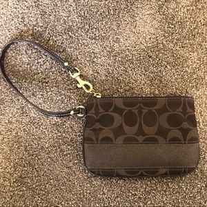 Chocolate brown Coach wristlet, used once.